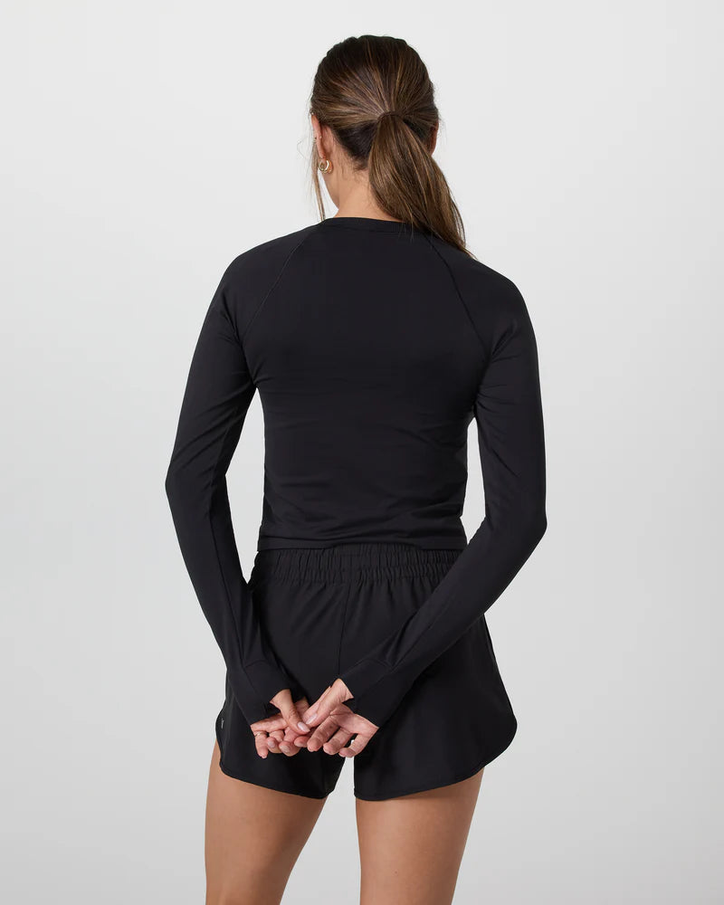 Vuori Women's Long Sleeve Seamless Surge Tee in Black